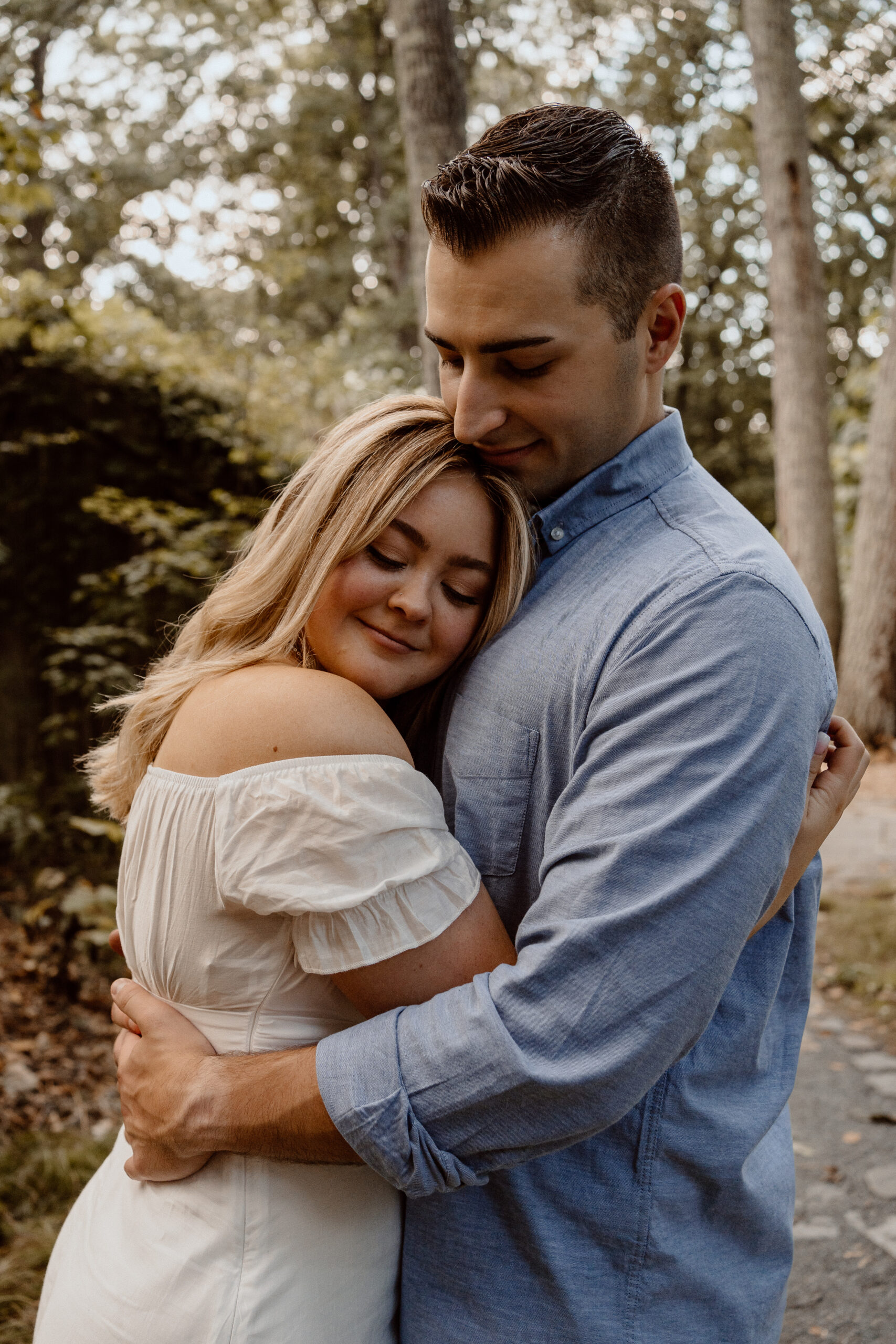 Romantic engagement photography at Garden in the Woods, Framingham, MA, featuring a loving couple amidst the enchanting scenery of this renowned botanical garden.
