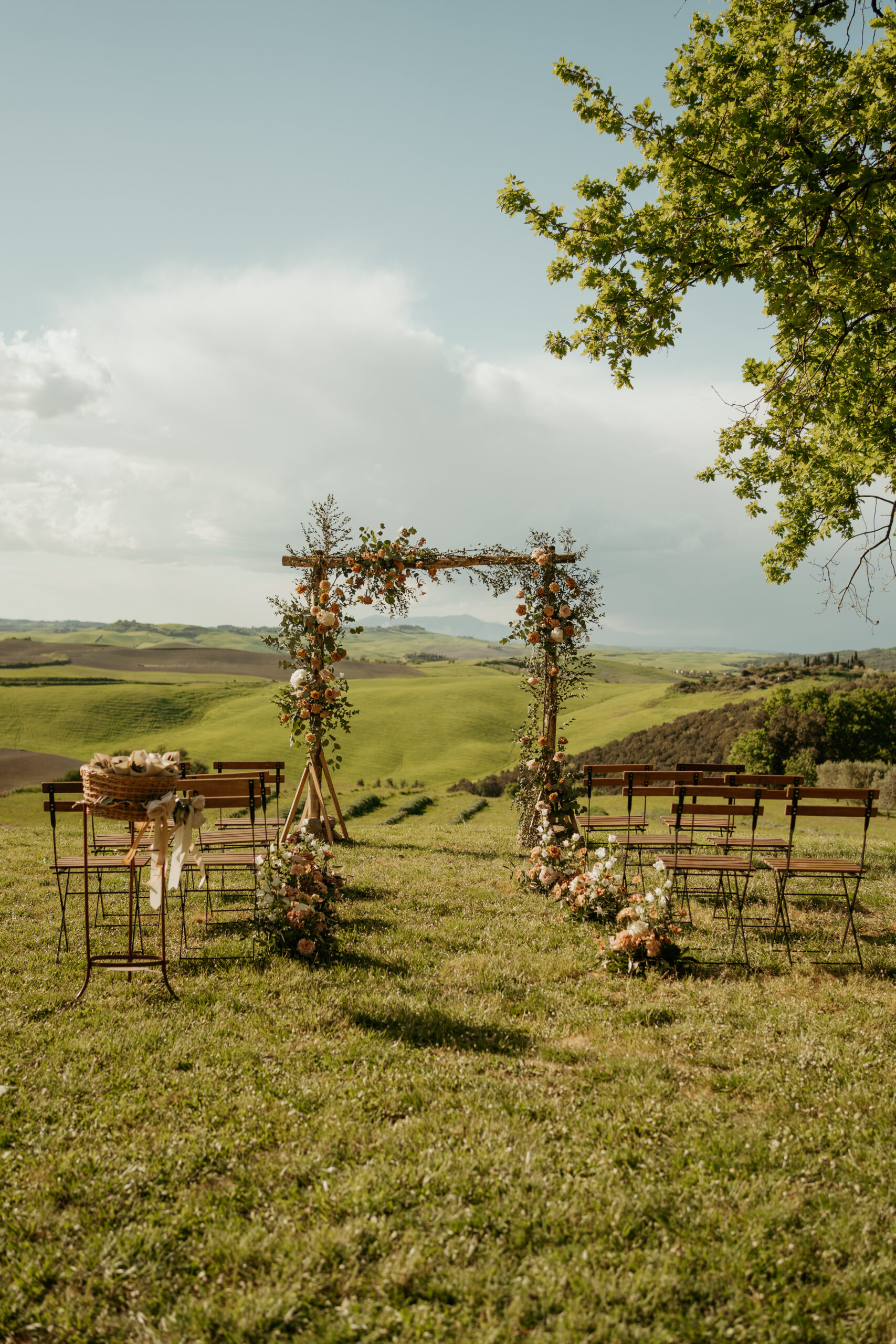 Italy Destination Wedding Ceremony Arch with Tuscan rolling hills in the background