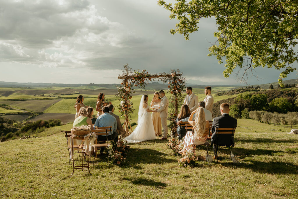 Tuscan destination wedding ceremony photographed by a destination wedding photographer