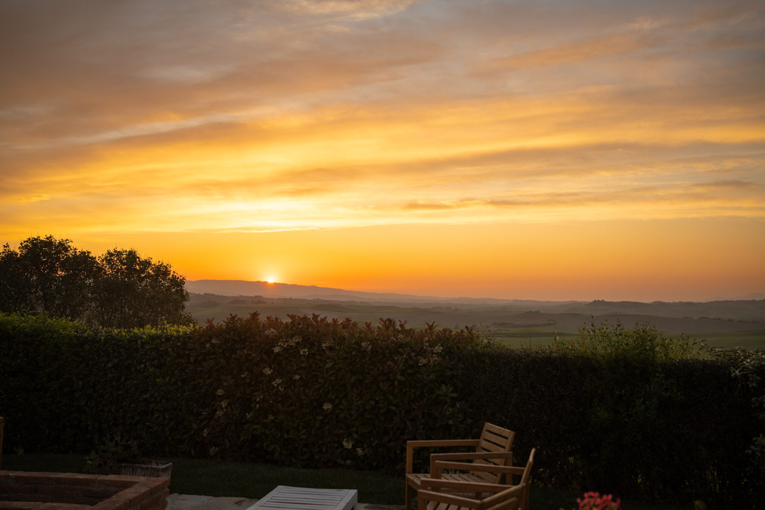 The Golden hour light is magical amongst the rolling hills for this Italian countryside wedding