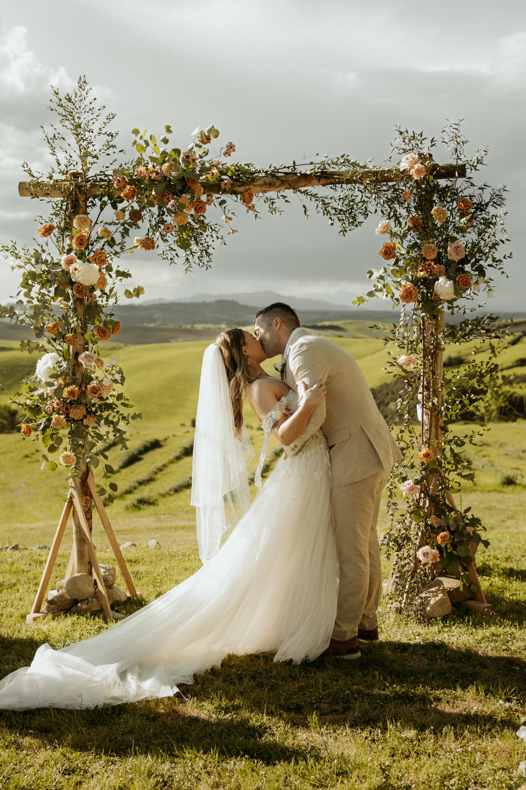 Bride & Groom kiss at their tuscan destination wedding