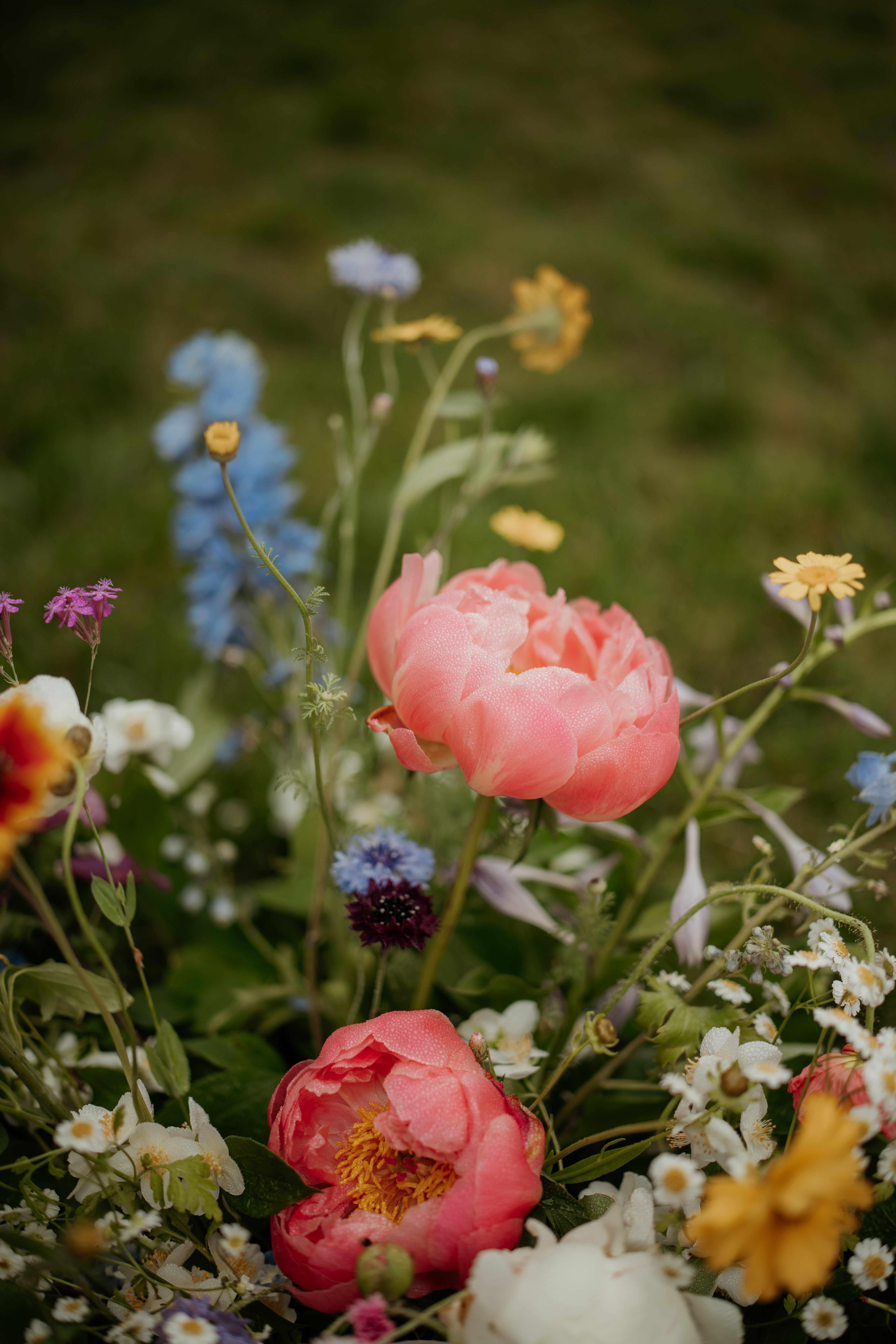 Colorful and whimsical wildflower bouquet made by after all floral, perfect for a summer garden party wedding.