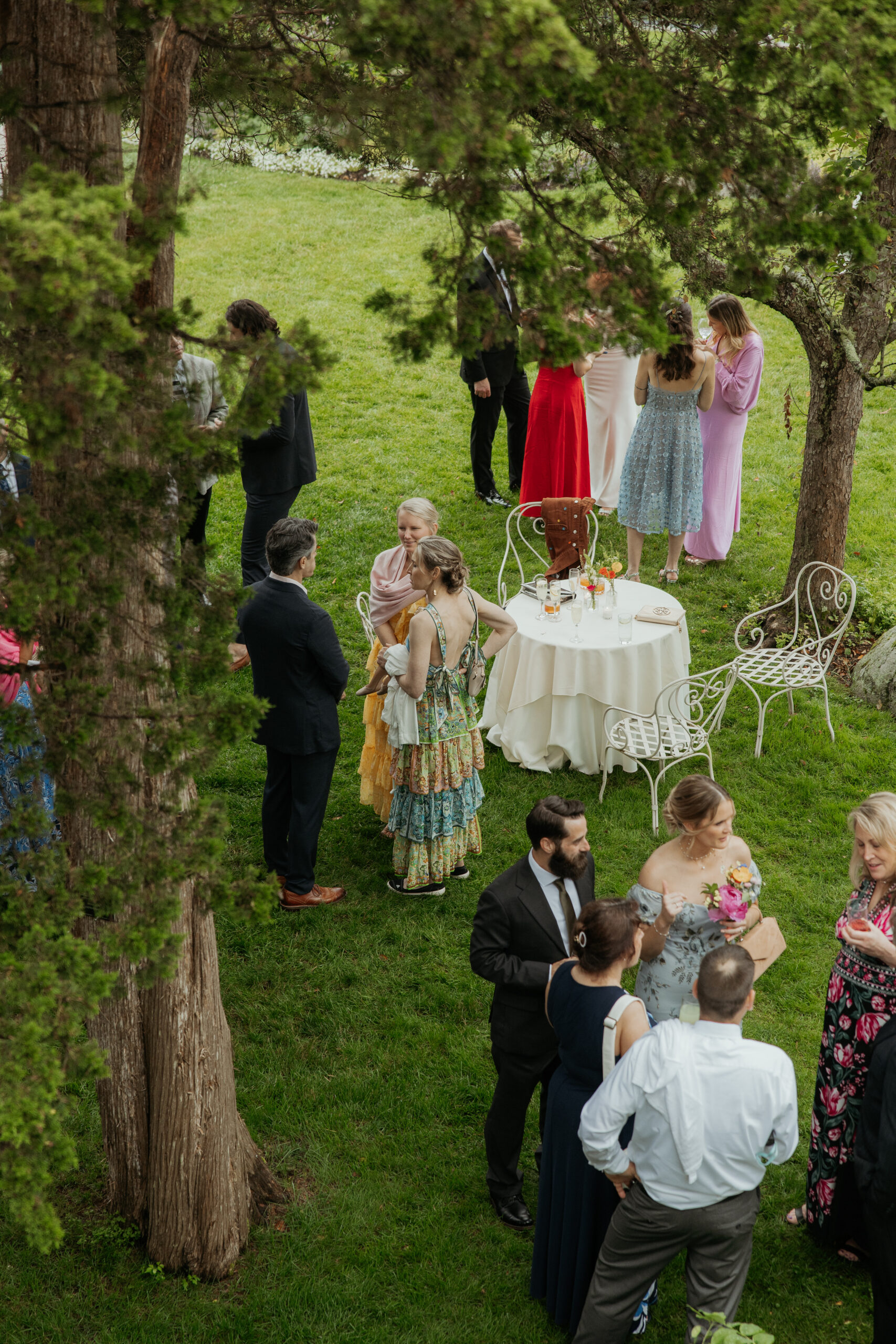 above view of guests mingling at cocktail hour in the gardens of Long Hill Wedding Venue